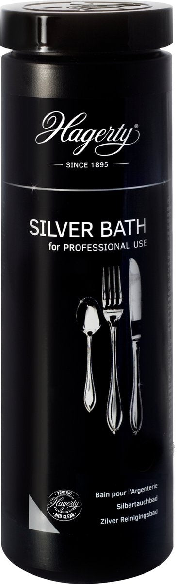 A black cylindrical container labeled 'Hagerty Silver Bath for Professional Use' with a illustration of silverware on the label.