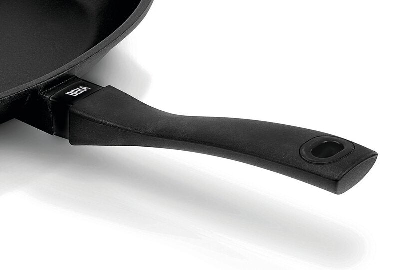 Black frying pan handle on a white background
