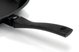 Black frying pan handle on a white background