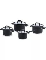 Set of black cookware pots with lids on a white background